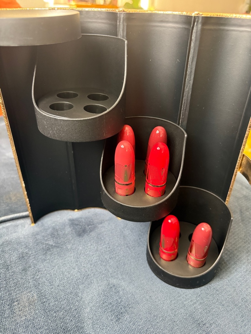 Gold mini Lipstick Organizer Display with a few brand new Lipstick
